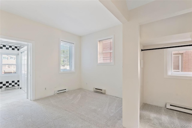 1355 N Franklin St Unit 5, Denver, CO 80218 - unfurnished bedroom with a baseboard radiator and carpet