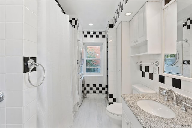 1355 N Franklin St Unit 5, Denver, CO 80218 - full bathroom with stacked washer / dryer, a shower with shower curtain, vanity, tasteful backsplash, and recessed lighting