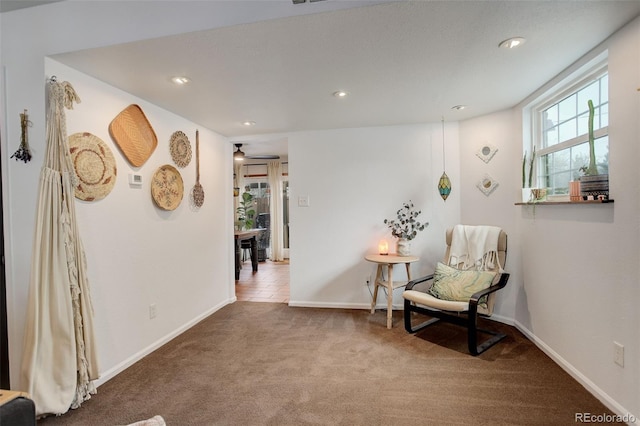 sitting room with carpet floors, recessed lighting, baseboards, and a ceiling fan