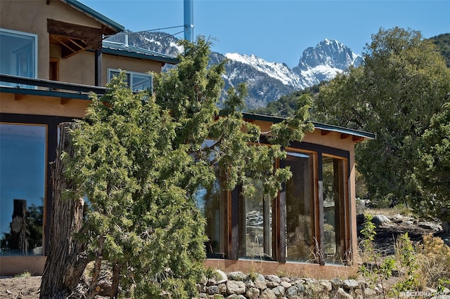 4417 Twinview Ct, Crestone, CO 81131 - view of home's exterior featuring stucco siding and a mountain view