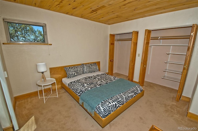 4417 Twinview Ct, Crestone, CO 81131 - bedroom with multiple closets, carpet flooring, wood ceiling, and baseboards