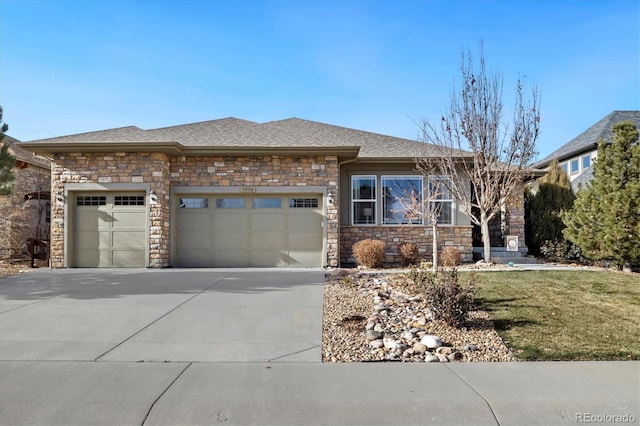 view of front of home with a front lawn and a garage