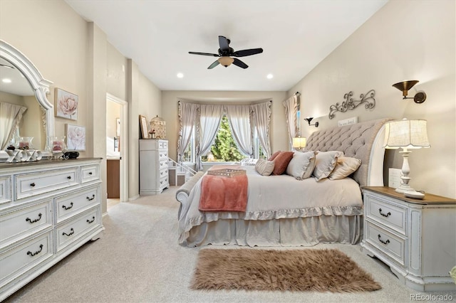 bedroom featuring light carpet and ceiling fan