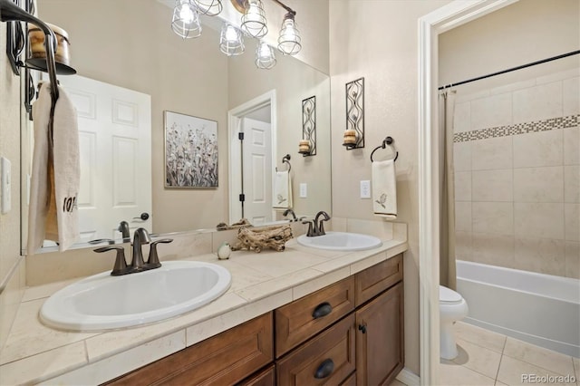 full bathroom featuring tile patterned flooring, shower / tub combo, vanity, and toilet