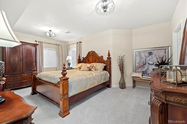 bedroom featuring light carpet