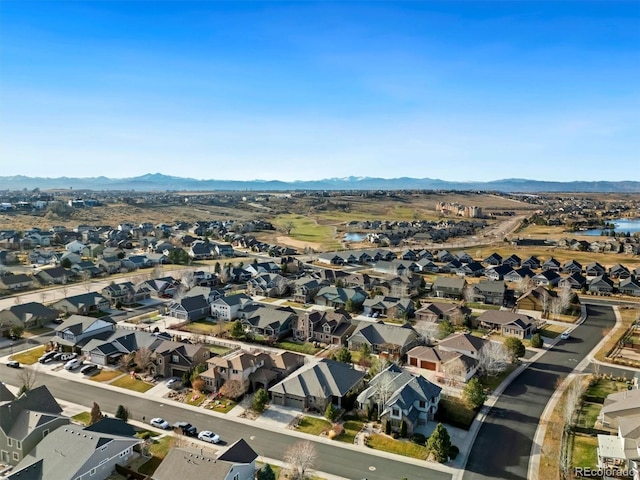 birds eye view of property featuring a mountain view