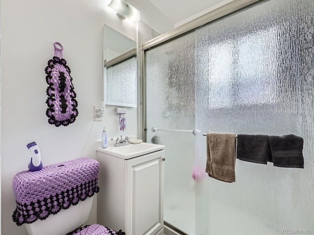 bathroom with sink and an enclosed shower