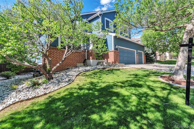 4630 Whitehall Ln, Highlands Ranch, CO 80126 - view of side of property featuring brick siding, a yard, and driveway