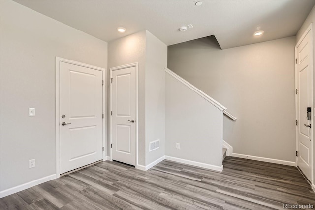 entryway with hardwood / wood-style floors