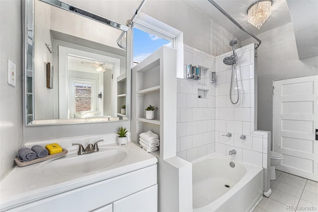 full bath with vanity, built in features, a ceiling fan, shower / tub combination, and toilet