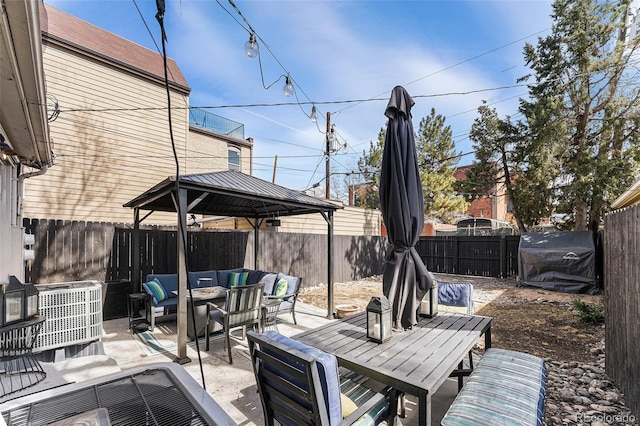 view of patio featuring outdoor dining space, an outdoor living space with a fire pit, and a fenced backyard