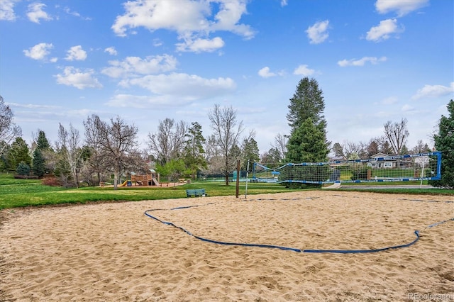 view of community with volleyball court and playground community