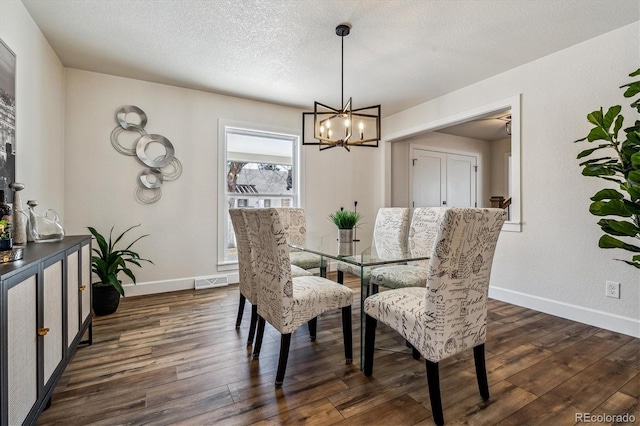 dining space with visible vents, baseboards, and dark wood-style flooring