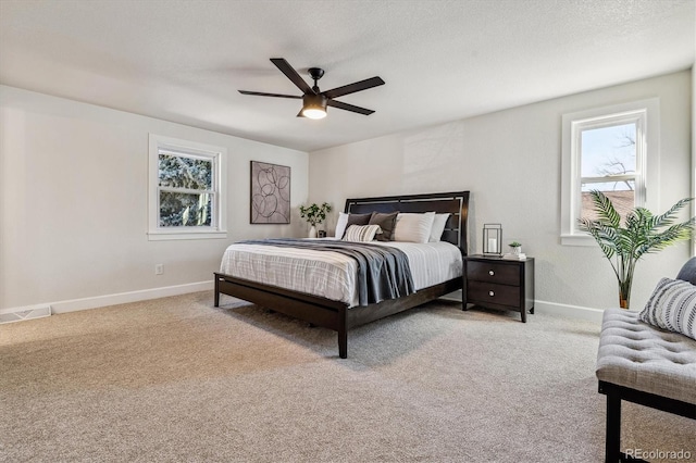 bedroom featuring multiple windows, light colored carpet, and visible vents