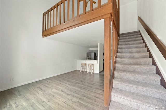 3550 S Harlan St Unit 363, Denver, CO 80235 - stairway featuring wood finished floors and baseboards