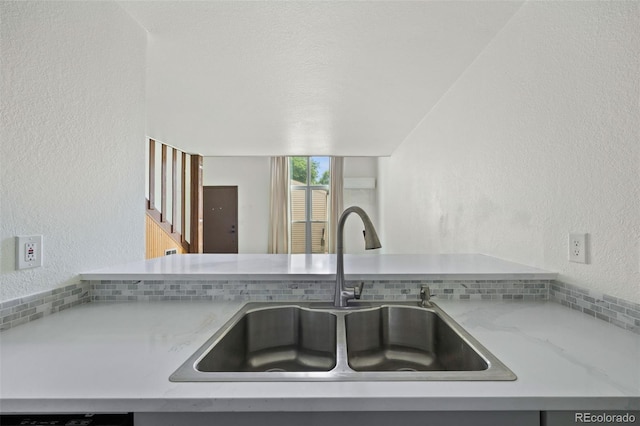 3550 S Harlan St Unit 363, Denver, CO 80235 - kitchen with a textured wall and light stone countertops