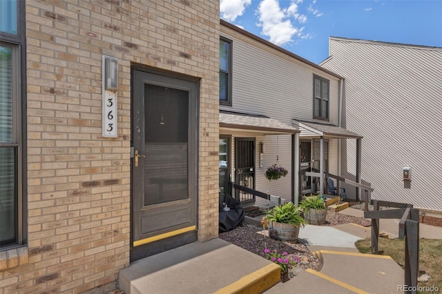 3550 S Harlan St Unit 363, Denver, CO 80235 - property entrance featuring brick siding