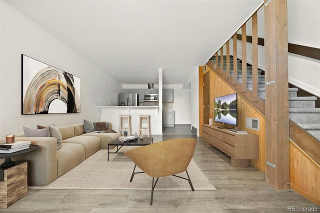 3550 S Harlan St Unit 363, Denver, CO 80235 - living room with stairway and light wood-style flooring
