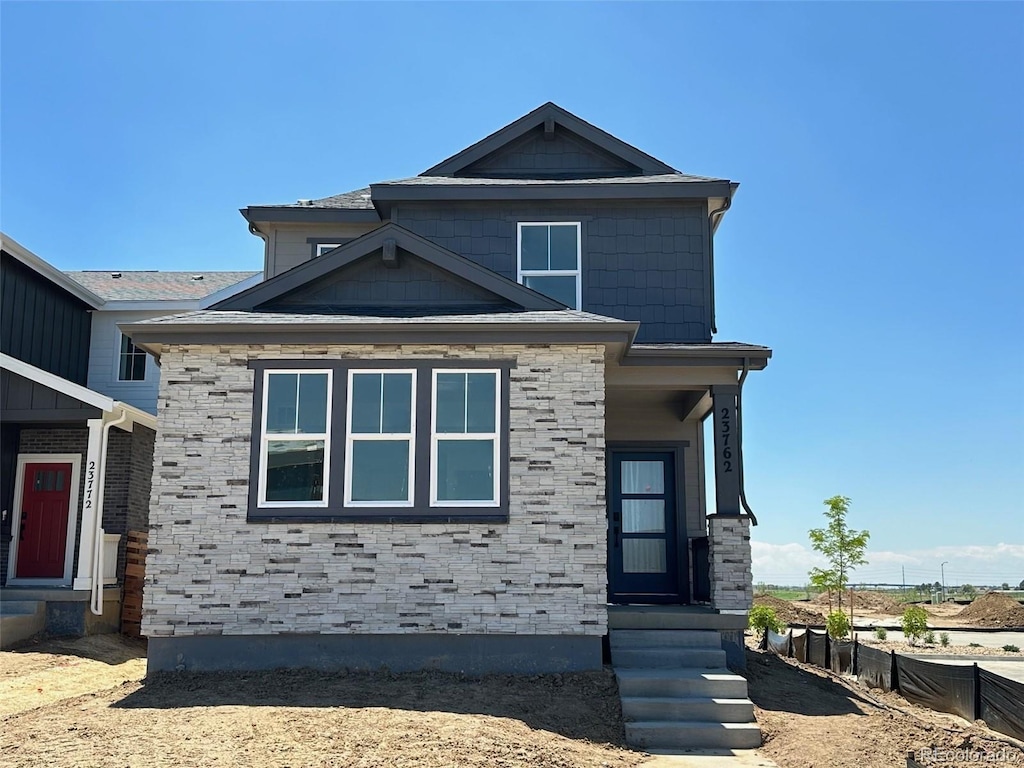 23762 E 33rd Pl, Aurora, CO 80019 - craftsman-style home with stone siding and entry steps