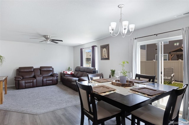 10869 Traders Pkwy, Fountain, CO 80817 - dining space featuring a chandelier, wood finished floors, and a ceiling fan
