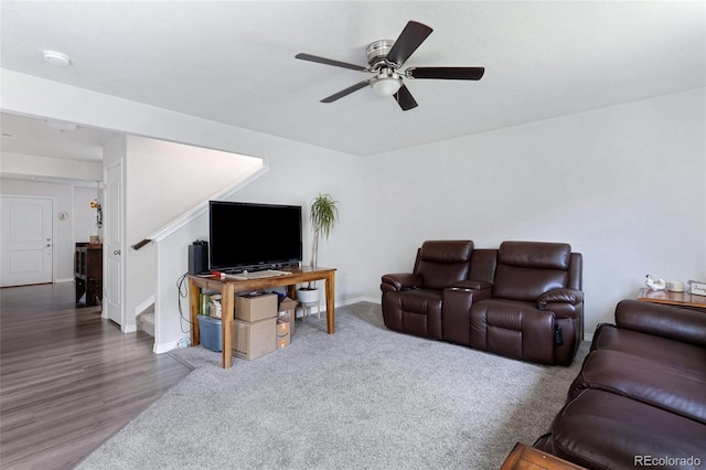 10869 Traders Pkwy, Fountain, CO 80817 - living room featuring ceiling fan, baseboards, wood finished floors, and stairway