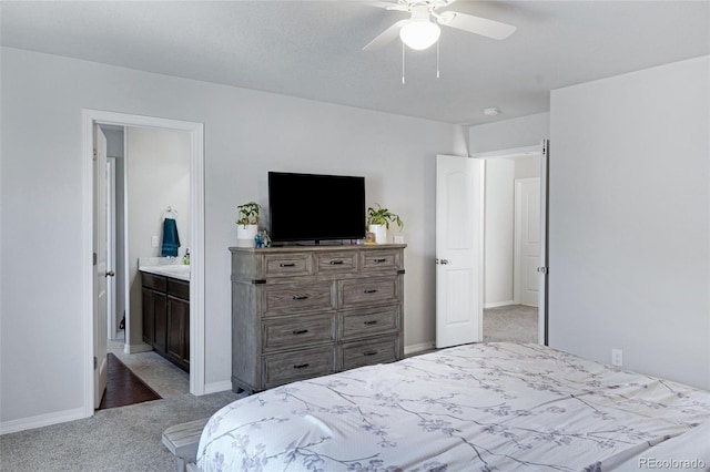 10869 Traders Pkwy, Fountain, CO 80817 - bedroom with light colored carpet, baseboards, a ceiling fan, and ensuite bath