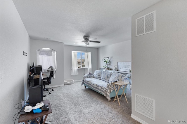 10869 Traders Pkwy, Fountain, CO 80817 - carpeted office featuring ceiling fan, baseboards, arched walkways, and a textured ceiling
