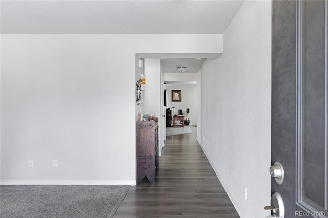 10869 Traders Pkwy, Fountain, CO 80817 - hallway featuring dark wood finished floors and baseboards