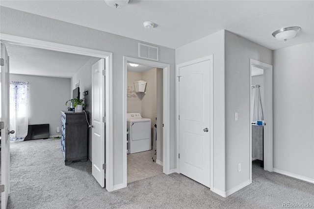 10869 Traders Pkwy, Fountain, CO 80817 - hall featuring washer / dryer, carpet floors, and baseboards