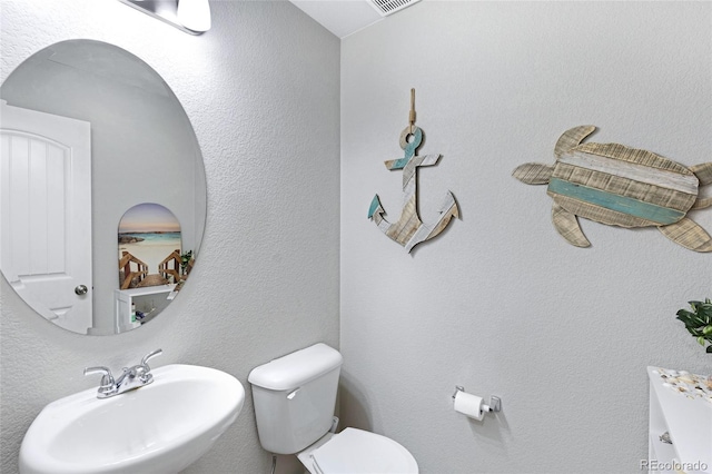10869 Traders Pkwy, Fountain, CO 80817 - half bathroom with toilet and a sink