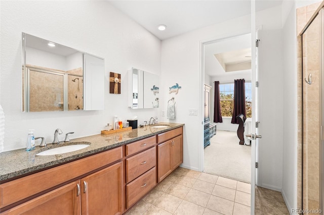 14805 Quince Way, Thornton, CO 80602 - full bathroom with connected bathroom, a stall shower, double vanity, and tile patterned flooring