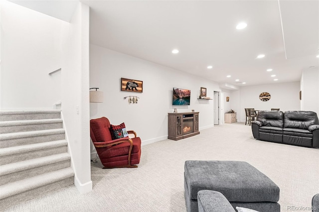 14805 Quince Way, Thornton, CO 80602 - living area with carpet flooring, recessed lighting, stairway, and a glass covered fireplace