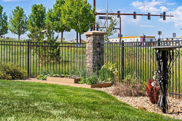 14805 Quince Way, Thornton, CO 80602 - gate with a vegetable garden
