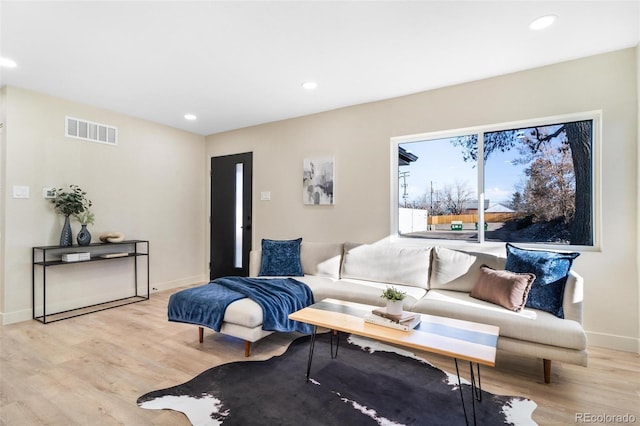 living room with light hardwood / wood-style floors