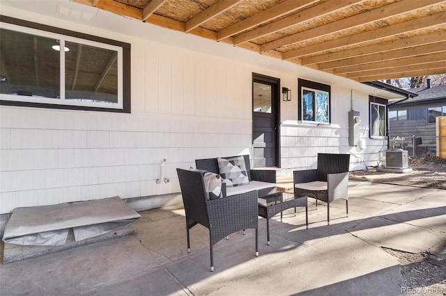 view of patio / terrace with outdoor lounge area and central AC