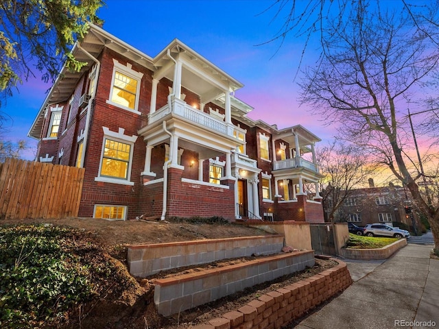 view of front of home featuring a balcony