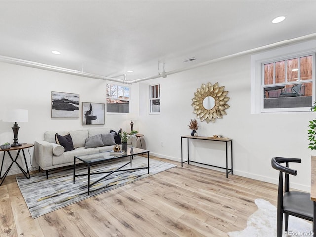 living room with light hardwood / wood-style flooring