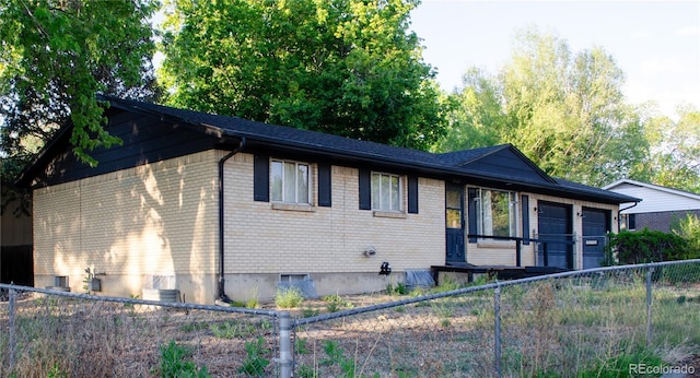 2308 Lelaray St, Colorado Springs, CO 80909 - single story home featuring brick siding and a garage