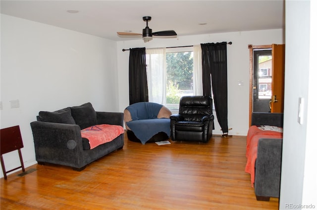 2308 Lelaray St, Colorado Springs, CO 80909 - living area with light wood-type flooring, a ceiling fan, and baseboards