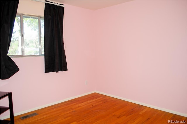 2308 Lelaray St, Colorado Springs, CO 80909 - empty room featuring wood finished floors and baseboards