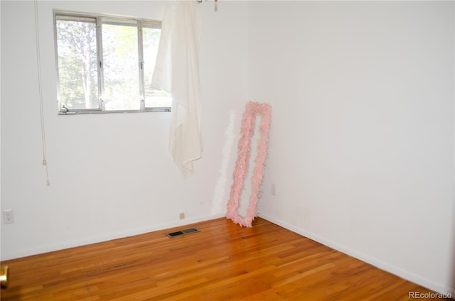2308 Lelaray St, Colorado Springs, CO 80909 - unfurnished room featuring wood finished floors and baseboards