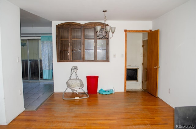 2308 Lelaray St, Colorado Springs, CO 80909 - unfurnished dining area featuring a chandelier and wood finished floors
