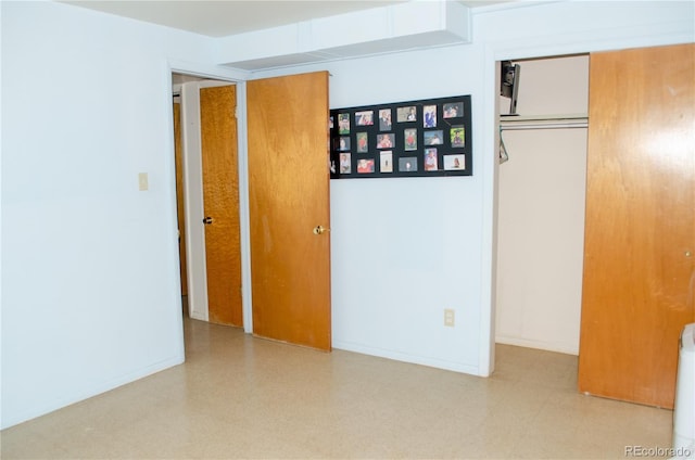 2308 Lelaray St, Colorado Springs, CO 80909 - unfurnished bedroom with tile patterned floors, a closet, and baseboards