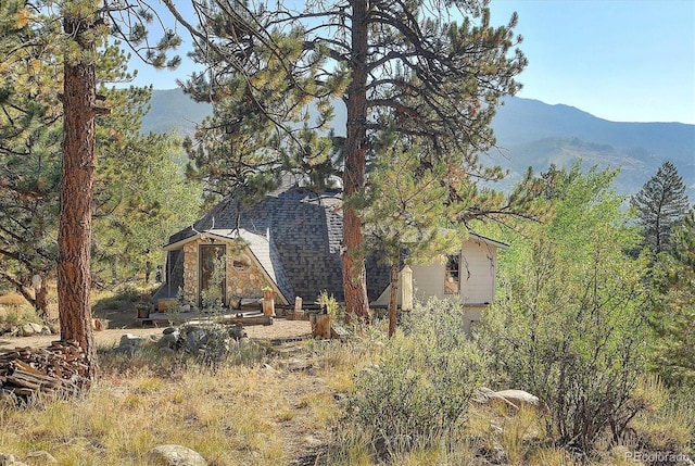 view of side of home featuring a mountain view