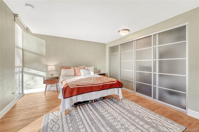 bedroom with light hardwood / wood-style flooring