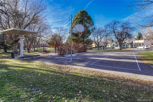 view of basketball court featuring a lawn