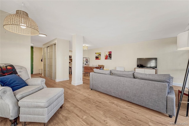 living room with light hardwood / wood-style flooring