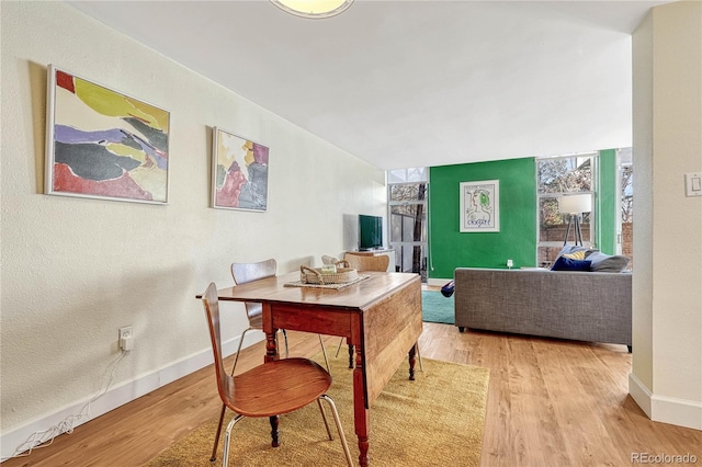 dining room with light wood-type flooring