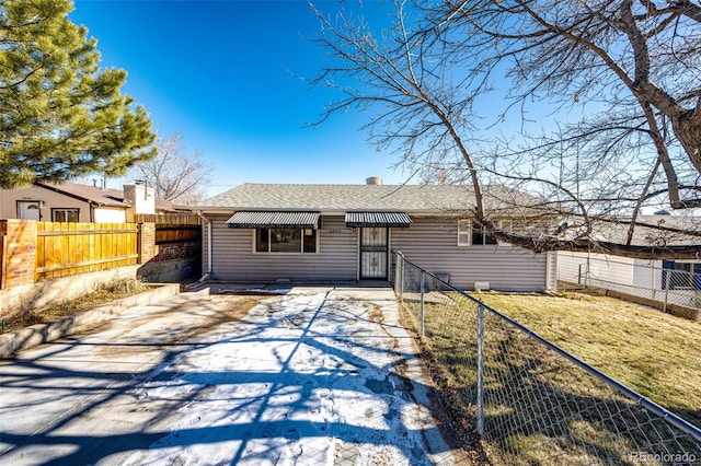 ranch-style house with a front lawn