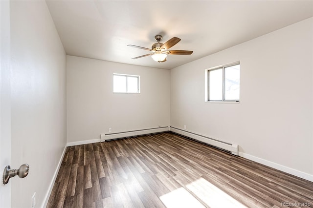 unfurnished room with ceiling fan, hardwood / wood-style flooring, and a baseboard heating unit